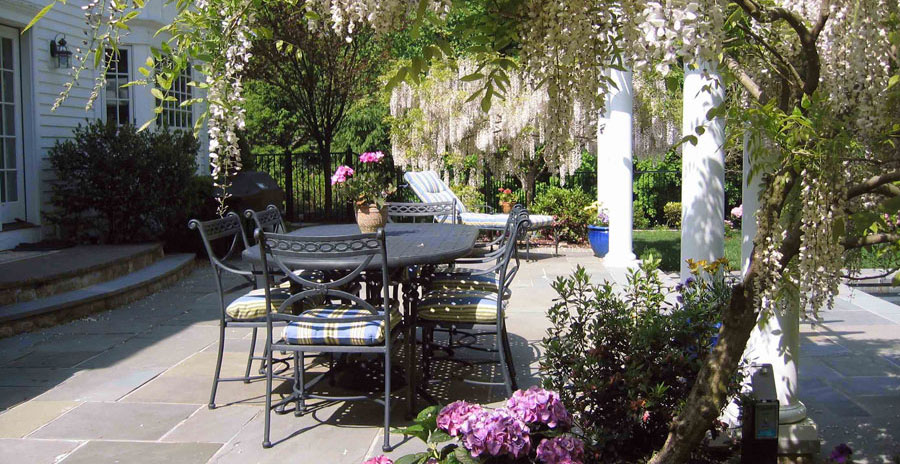 Bluestone terrace and wisteria covered trellis New Canaan CT